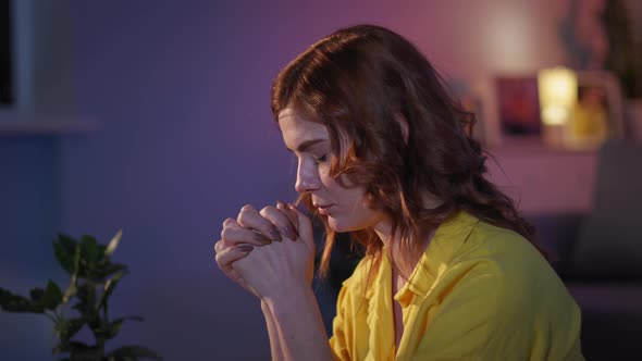 Female Christian with Hope and Faith in Her Heart Prays with Folded Hands to Beloved God During alt