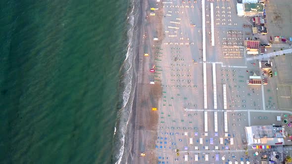 The Aerial View of the White Chairs on the Shore in Rimini