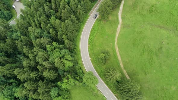 Aerial Flight Over Cars Driving on Serpentine Road in Alps Mountains in Germany
