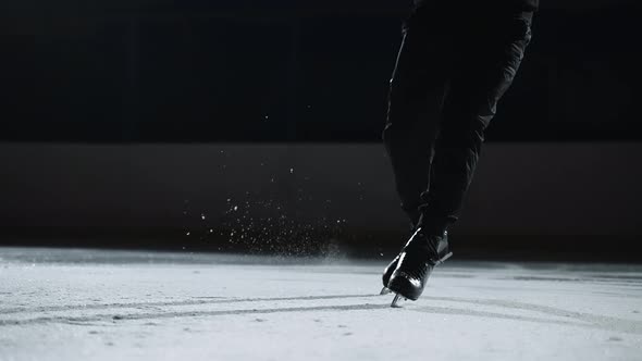Male Figure Skater is Training or Performing Program on Competition Closeup View on Feet Shod Skates alt