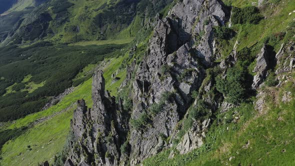 Aerial view of rocky peak of Spitz mountain in the Carpathian mountains, landscape alt