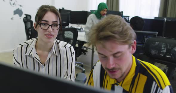 Concentrated Male Businessman Looking at Computer Monitor Working at Startup Office alt