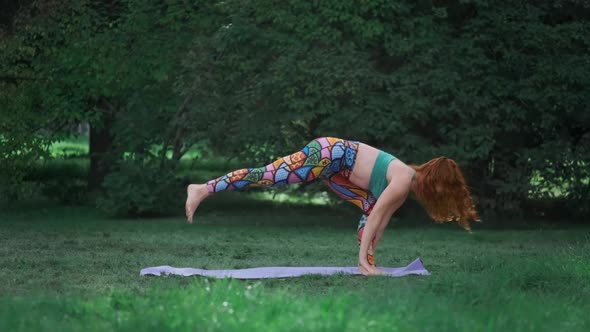 Woman Practices Yoga in Park alt