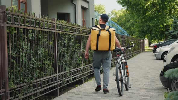 Courier with Bike Looking for Delivery Address