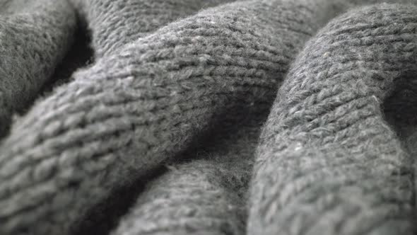 Extreme detail view of sheep wool cloth texture flowing in macro dolly shot. alt