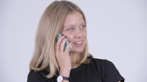 Face of Young Happy Blonde Woman Talking on the Phone alt