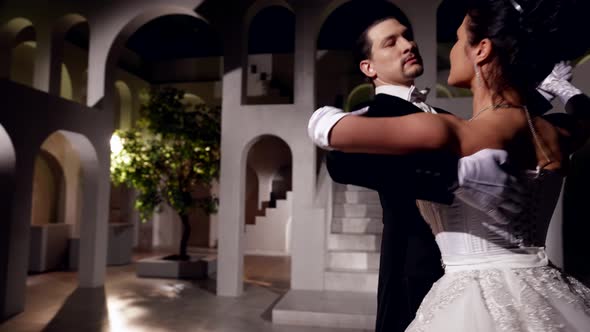 Professional Dancers are Whirling in Waltz in Ballroom Romantic Atmosphere of Old Fashioned Ball alt
