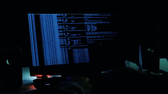 Programmer Enters The Settings. A Male Hacker Is Hacking Into Security Systems alt