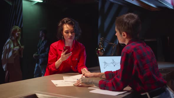 Woman Photographs a Sketch of a Tattoo. Slowmotion alt