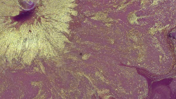 Glitter gold and pink colors abstract background. Liquid shiny texture in motion alt
