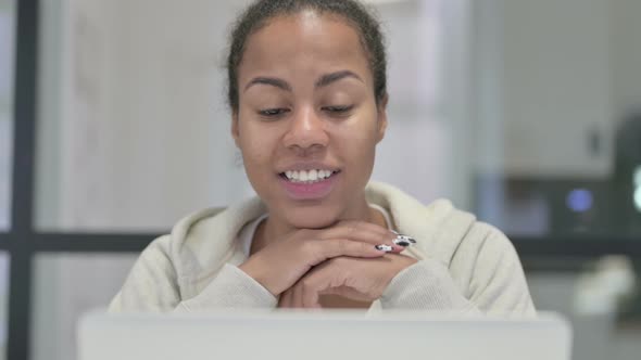 Close Up of African Woman Talking on Video Call on Laptop alt