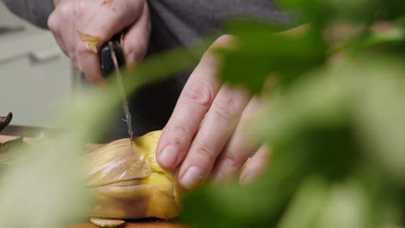 Woman Cut Artichoke alt