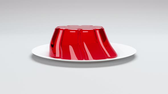 Sliding Red Jello On Plate over White Background Loop