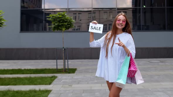 Young Girl Showing Black Friday Inscription Text Advertisement. Online Shopping with Low Prices alt