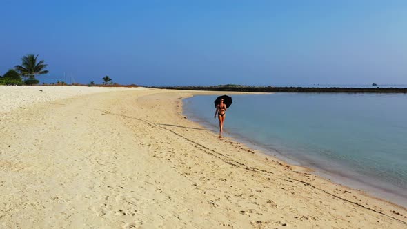Women happy together on beautiful island beach lifestyle by blue sea with clean sand background of K alt
