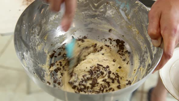 Chef Adds Chocolate To Dough and Mixes To Make Chocolate Muffin, Pie or Pastry