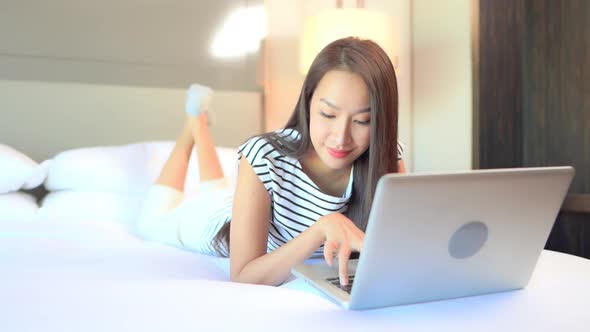 Young asian woman use laptop alt
