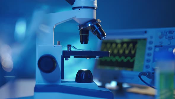 Close Up of a Optical Scientific Microscope in Laboratory alt