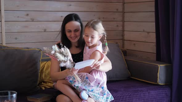 Child Daughter Greeting Her Mother at Mothers Day alt