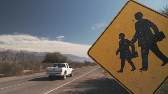 Road Safety Sign for School Children Crossing in an Endless Road. 4K.