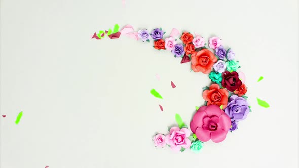 Beautiful Assorted Multicolored Paper Flowers Move in a Circle in Different Phases and Cycles alt