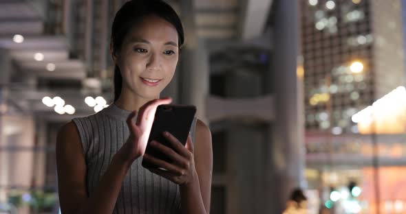 Woman use of smart phone in city  alt