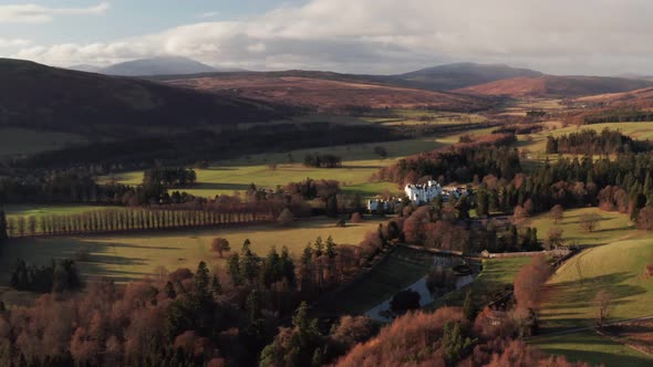 Wonderful Scenery Of A Castle in Blair Atholl, Scotland Surrounded By Glorious Trees - Aerial Shot alt
