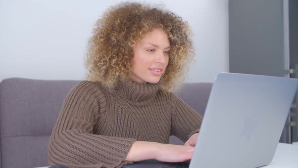 Cheerful whilte woman working freelance from home on lockdown in 4k stock video alt
