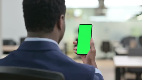 Businessman Using Smartphone with Green Chroma Key Screen alt