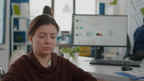 Close Up of Business Woman with Disabilities Looking Sad at Camera alt