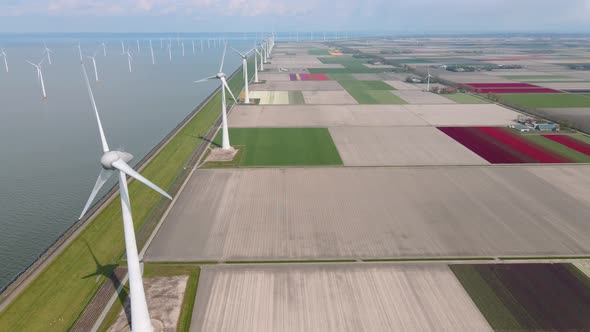 Offshore Windmill Park with Clouds and a Blue Sky Windmill Park in the Ocean Drone Aerial View with alt