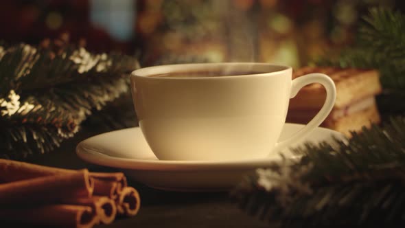 White cup of hot coffee on a brown wooden table alt