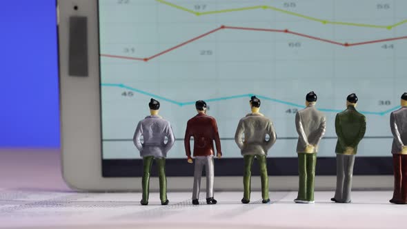 Business Figurines  Watching a Chart