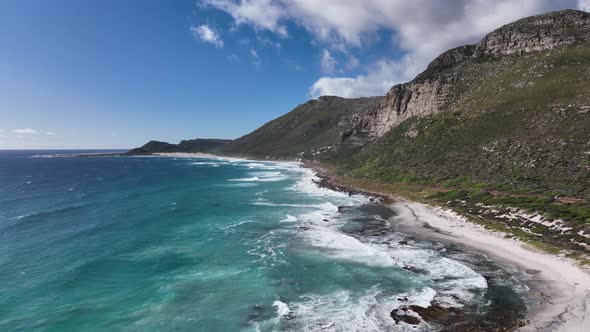 Unspoilt sandy beach at Misty Cliffs, jagged Cape Peninsula coastline; aerial alt