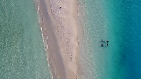 Drone aerial abstract of exotic island beach by blue sea with sand background alt