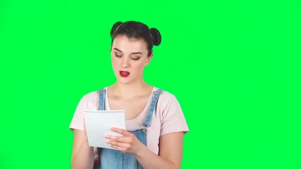 Girl Stands and Thinks, Writes with Pencil in Notebook, Then Upset, Slow Motion alt