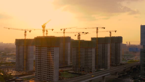 Aerial of construction site at sunset alt