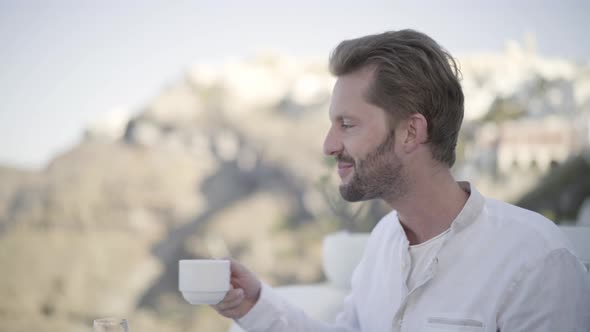 Smiling Man Having Breakfast Closeup alt