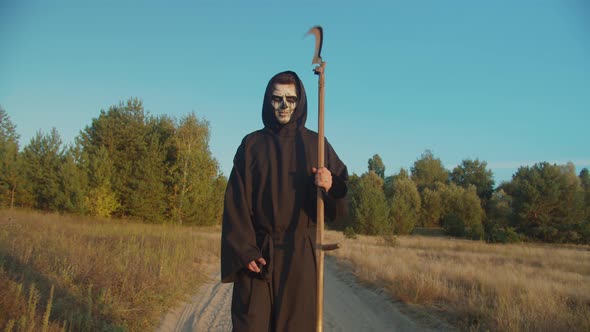 Death Reaper Frightening with Scythe on Dirt Road alt