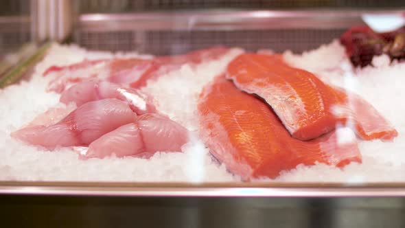 Seafood on Ice in Fridge at Fish Shop alt