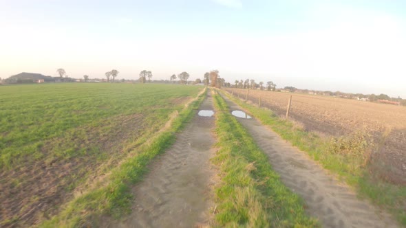 POV Driving on Rough Rural and Closed Road Between the Farmfields alt