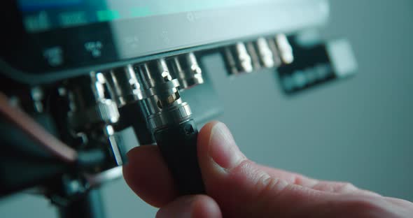Video connector BNC SDI plug in close up slow motion 4K