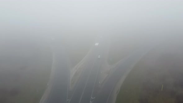 Strong Fog on the Road Aerial Drone View