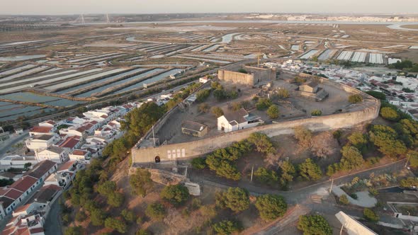Fortified walled medieval castle of Castro Marim. Panoramic aerial pullback alt