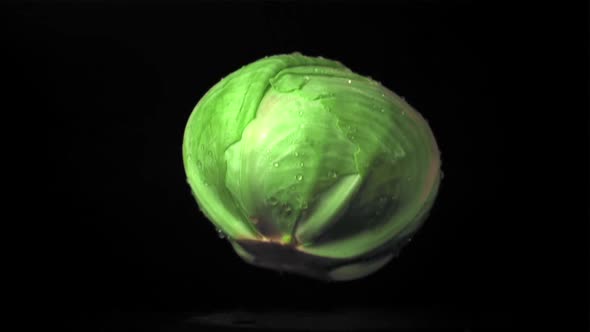 Super Slow Motion Forks Cabbage Falls on the Table with Splashes of Water alt