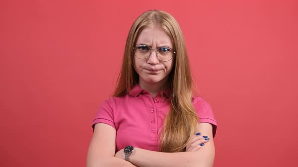 Close Up of a Displeased Young Woman Is Crossing Hands and Feeling Offended. alt