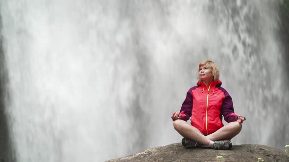 Woman Doing Yoga Pose Lotus Opposite Big Waterfall