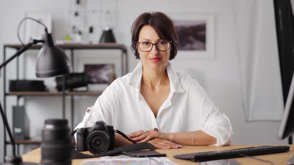 Portrait of Smiling Female Photographer