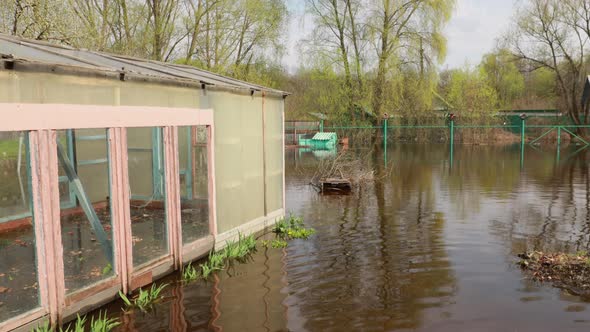 Vegetable Garden Beds In Water During Spring Flood Floodwaters During Natural Disaster alt