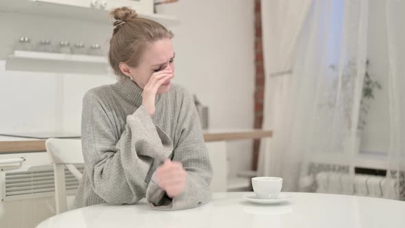 Unhappy Young Woman Thinking and Crying at Home alt